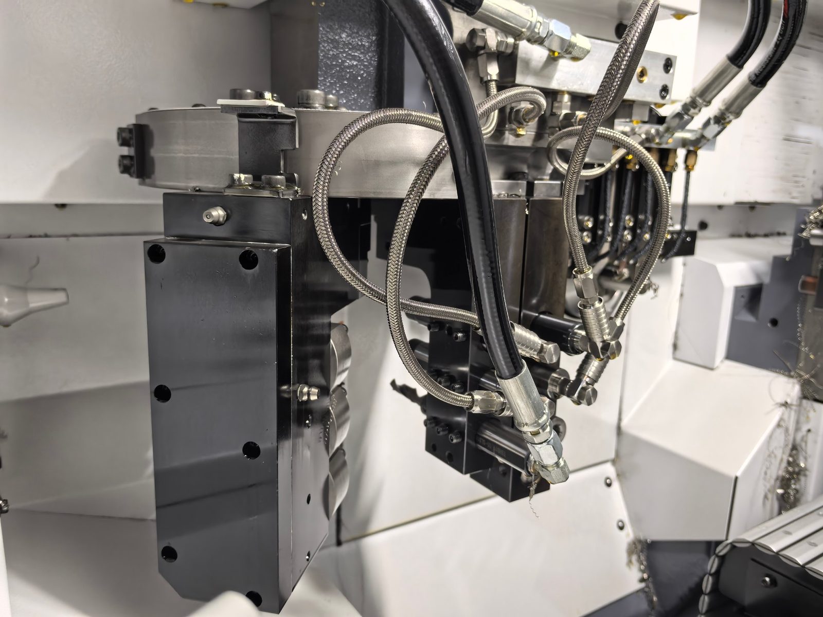 Tooling zone of a sliding-headstock lathe showing sub-spindle and driven tooling