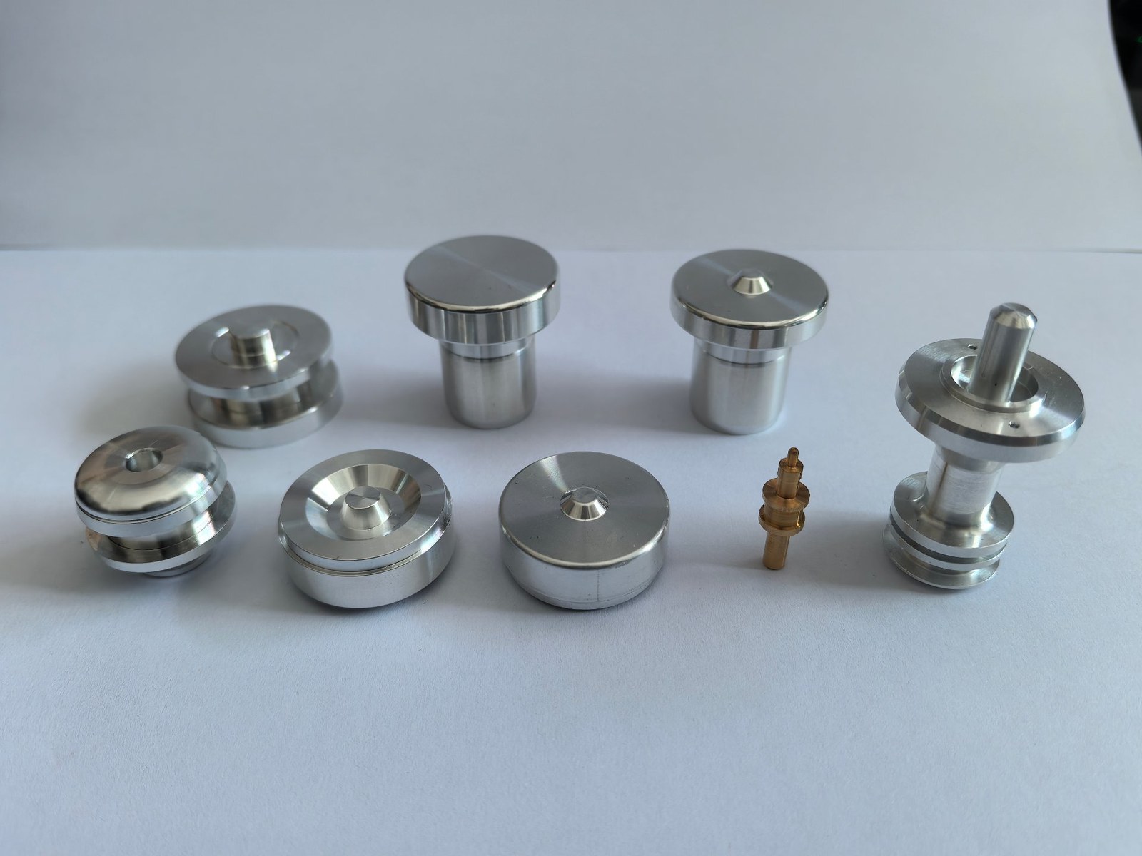 Group of automotive turned components in stainless steel, as-machined finish